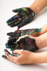 Image showing Kids hands covered with paint 