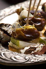 Image showing Appetizer Plate with Dactyl, Pecan nuts and Cheese