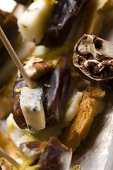 Image showing Appetizer Plate with Dactyl, Pecan nuts and Cheese