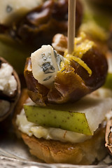 Image showing Appetizer Plate with Dactyl, Pecan nuts and Cheese