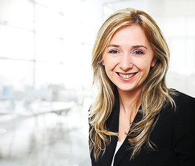 Image showing smiling woman in office