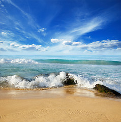 Image showing stones in the waves on ocean coast