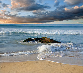 Image showing stones in the waves on ocean coast