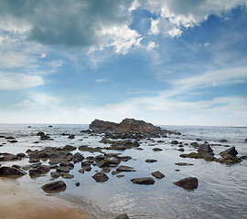 Image showing stones in the waves on ocean coast