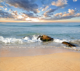 Image showing stones in the waves on ocean coast