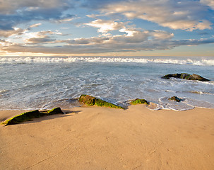 Image showing stones in the waves on ocean coast