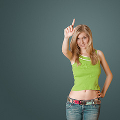 Image showing young woman with up finger