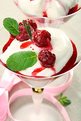 Image showing Yoghurt panna cotta with cherry sauce.