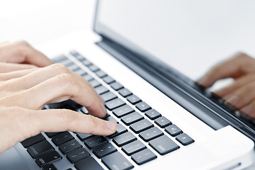 Image showing Hands typing on laptop keyboard