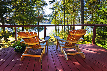 Image showing Forest cottage deck and chairs