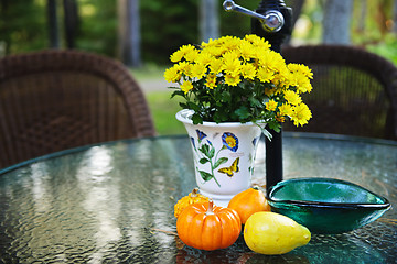 Image showing Fall table with gourds and flowers