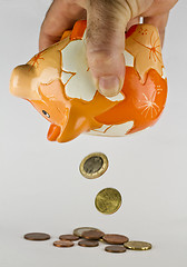 Image showing piggy bank with falling coins