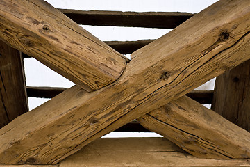 Image showing wooden cross in old roof