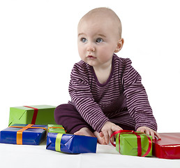 Image showing young child unpacking presents