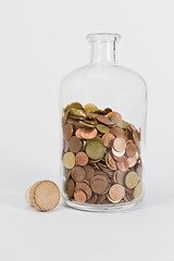 Image showing coins in glas bottle