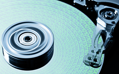 Image showing hard disk drive in motion with data - (zero-six)