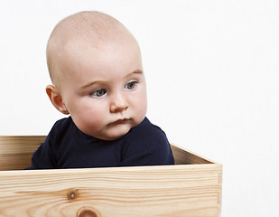 Image showing toddler in wooden box