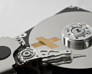 Image showing hard disk drive with band-aid