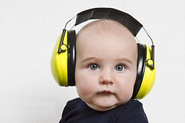 Image showing baby with ear protection