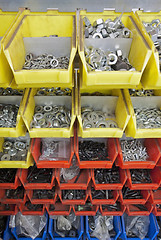 Image showing screws and nuts in colored boxes