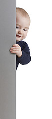 Image showing young child holding vertical sign