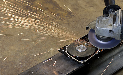 Image showing open hard disk with circular saw