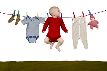 Image showing young child at clothes line