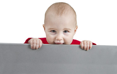 Image showing young child holding grey sign