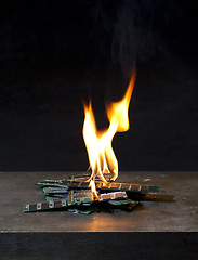 Image showing burning ram in black background