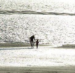 Image showing Parent with Child on the Beach