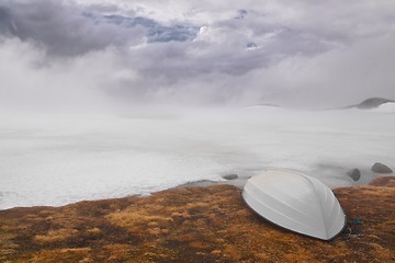 Image showing Moody sky by frozen lake