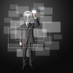 Image showing full length businessman with lamp-head push the button