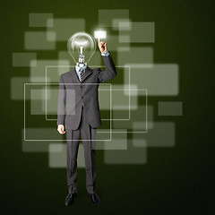 Image showing full length businessman with lamp-head push the button