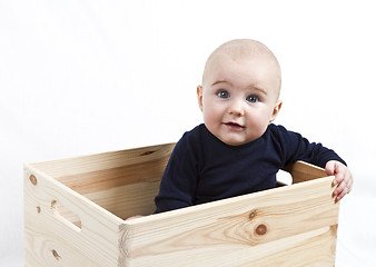 Image showing toddler in wooden box