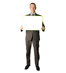 Image showing happy businessman holding blank white card