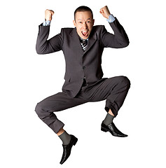 Image showing Happy businessman jumping