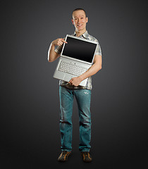 Image showing man with open laptop in his hands