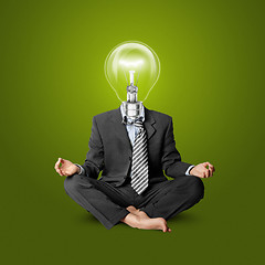 Image showing lamp-head businessman in lotus pose
