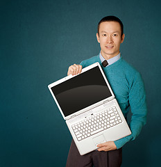 Image showing Male in blue with laptop