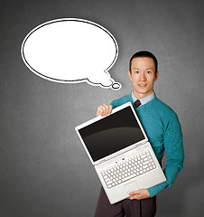 Image showing Male in blue with laptop and comics bubble