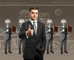 Image showing lamp head business people with laptops