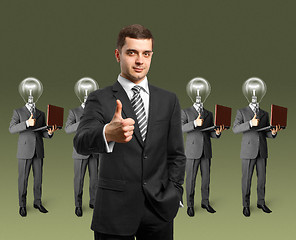 Image showing lamp head business people with laptops