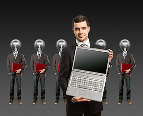 Image showing lamp head businesspeople with laptop