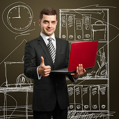 Image showing male in suit with laptop in his hands