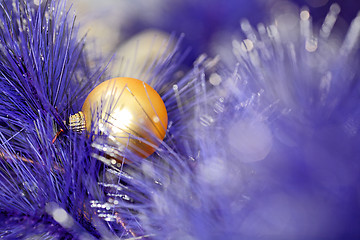 Image showing christmas ball on blue color christmas tree