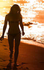 Image showing Woman on the beach at sunset