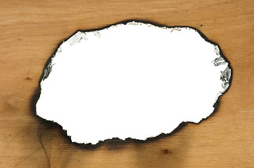 Image showing Burned wooden paper and hole