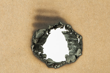 Image showing Burned paper and hole