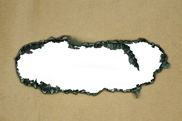 Image showing Burned paper and hole
