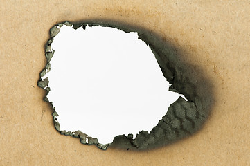 Image showing Burned paper and hole